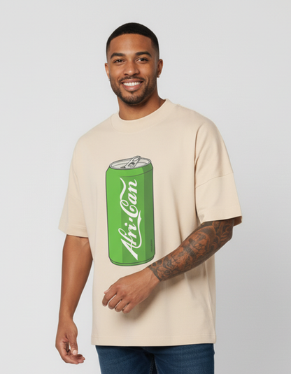 Man wearing an off-white oversized t-shirt with a green can graphic and 'Afri-Can' text on a plain background
