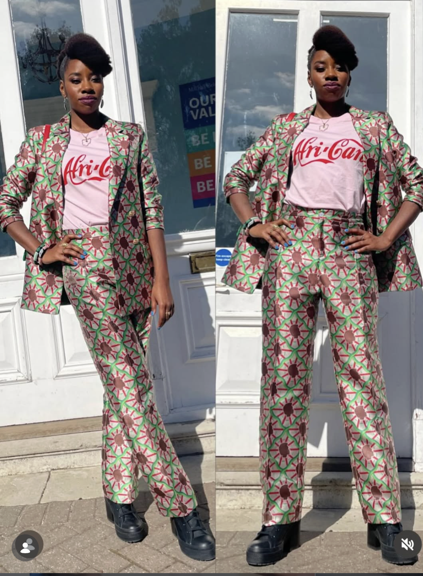 Black woman wearing a pink t-shirt with the word Afri-Can in red font, reminiscent of a popular Cola's font.