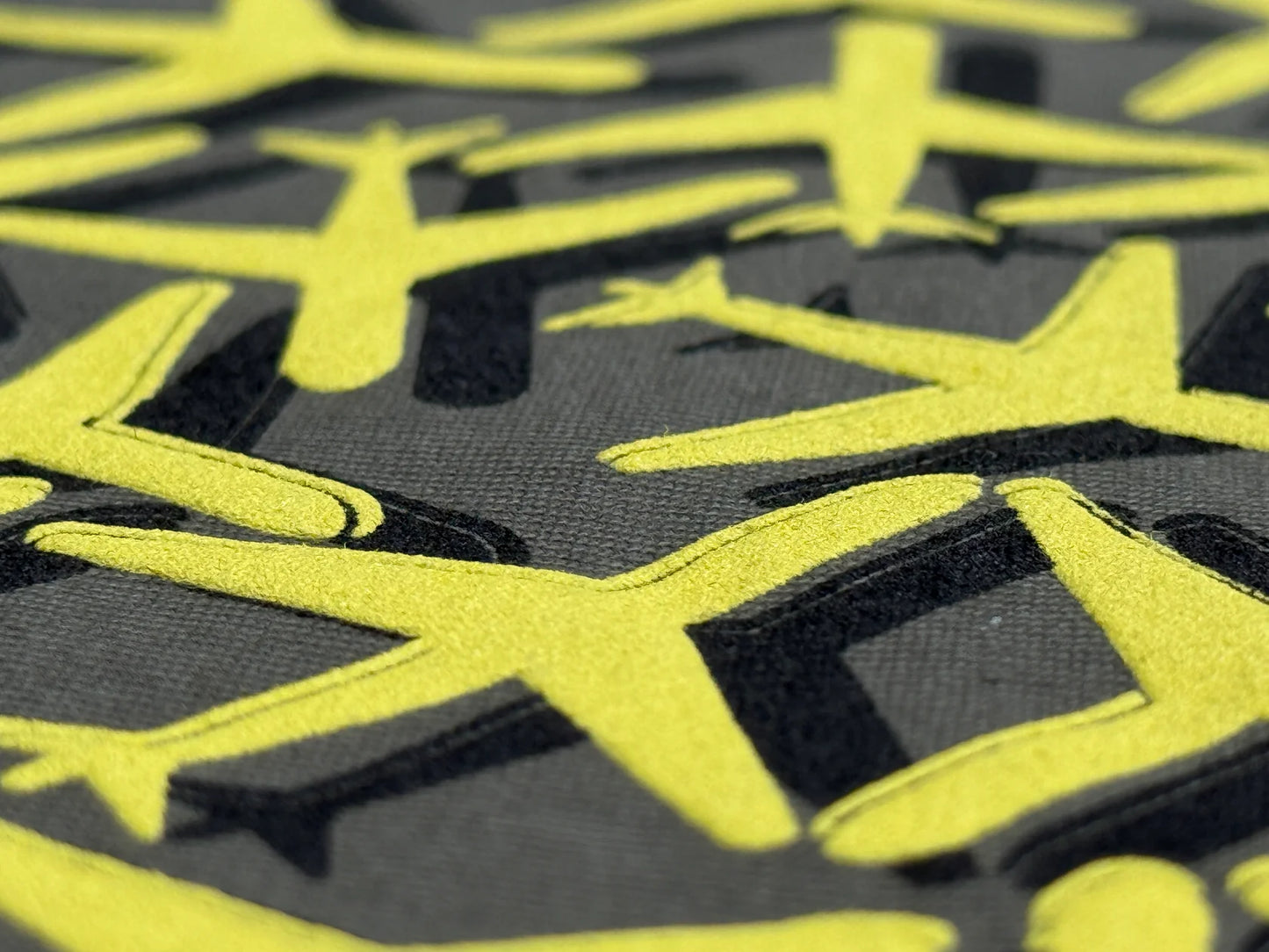 Close-up of yellow and black geometric patterned fabric