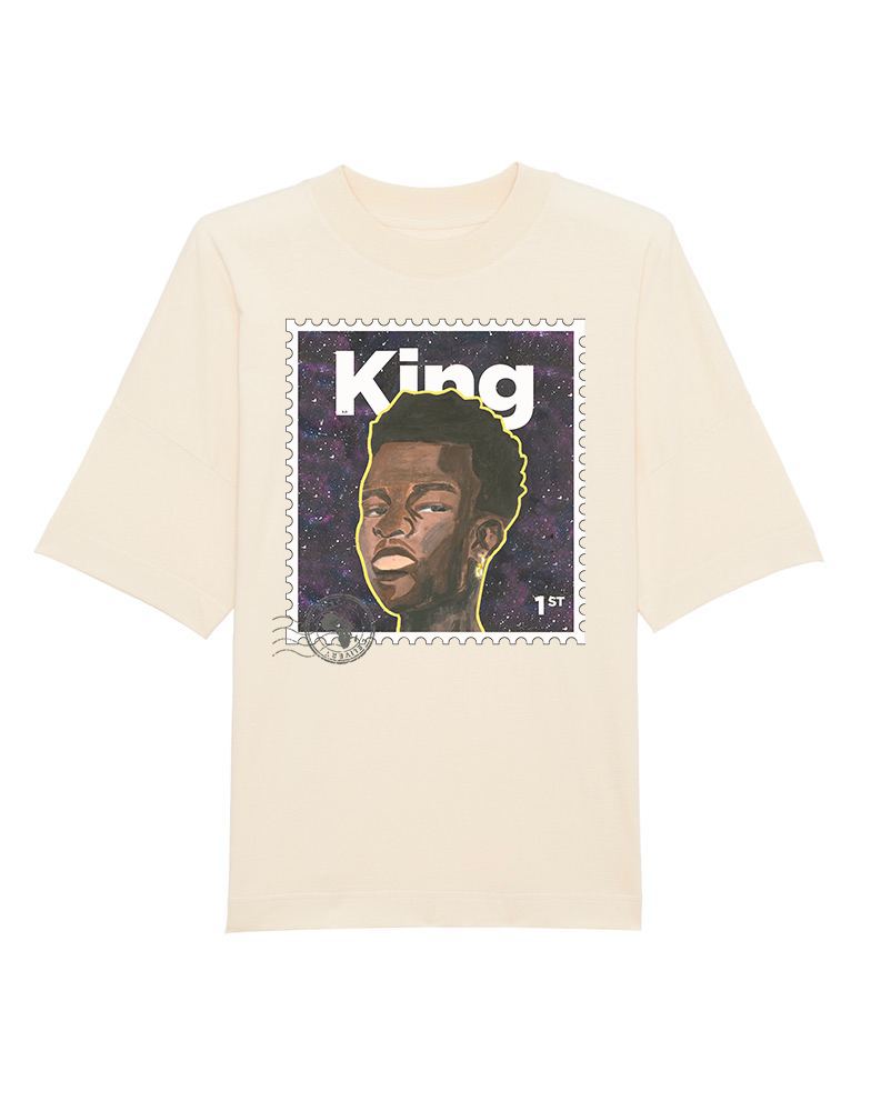 An off-white organic cotton oversized T-shirt with a 'KING' text design and a stylized image of a person on the front.